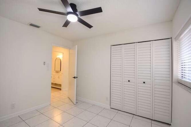 11405 Whisper Lake Way, Boca Raton, FL 33428 - unfurnished bedroom with a closet, light tile patterned flooring, baseboards, and a ceiling fan