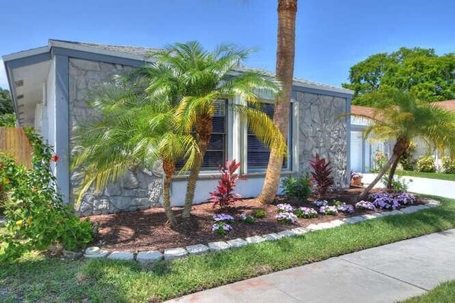 11405 Whisper Lake Way, Boca Raton, FL 33428 - view of side of home with stone siding and a garage