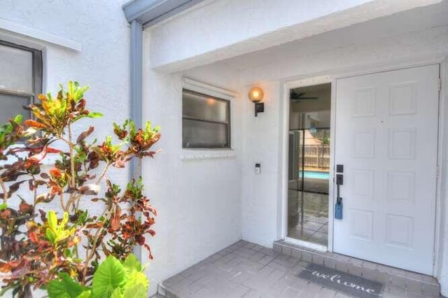 11405 Whisper Lake Way, Boca Raton, FL 33428 - doorway to property with stucco siding