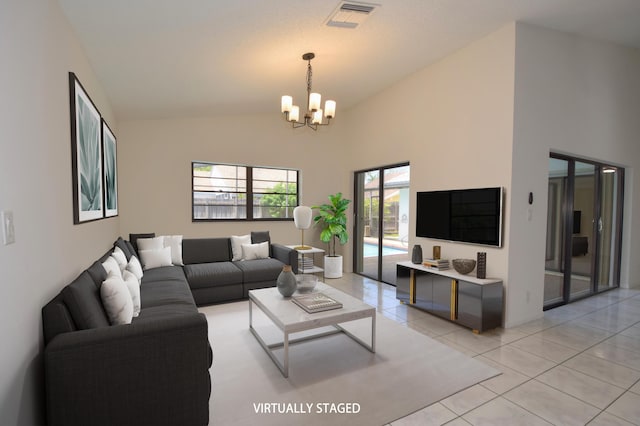 11405 Whisper Lake Way, Boca Raton, FL 33428 - living area featuring a chandelier, light tile patterned flooring, and high vaulted ceiling