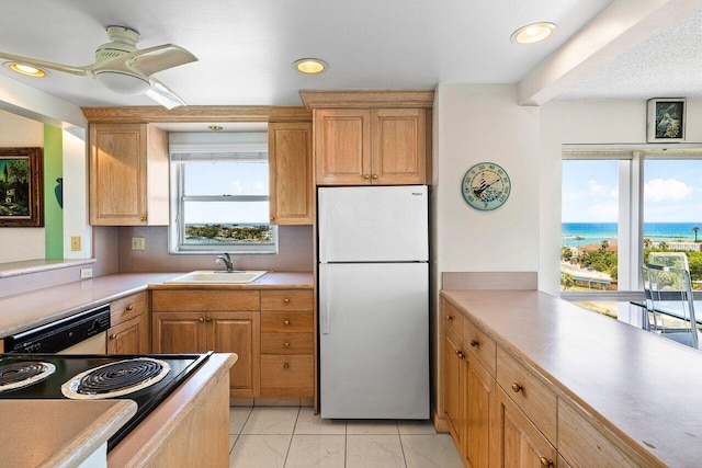 2611 N Riverside Dr Unit 908, Pompano Beach, FL 33062 - kitchen featuring white appliances, a sink, ceiling fan, light countertops, and recessed lighting