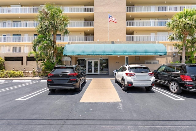 2611 N Riverside Dr Unit 908, Pompano Beach, FL 33062 - view of apartment building / complex featuring uncovered parking