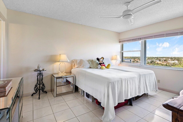 2611 N Riverside Dr Unit 908, Pompano Beach, FL 33062 - bedroom featuring a textured ceiling, ceiling fan, and baseboards