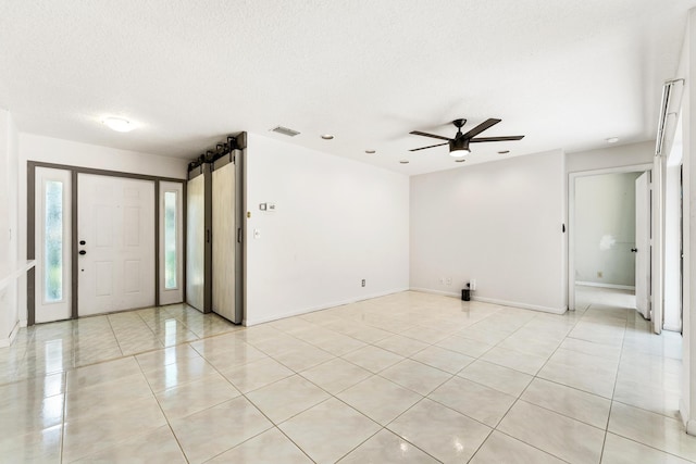 2561 Carambola Cir N Unit 1848Bldg 8, Coconut Creek, FL 33066 - unfurnished room with ceiling fan, a textured ceiling, light tile patterned floors, baseboards, and recessed lighting