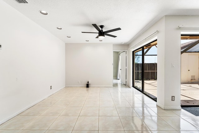 2561 Carambola Cir N Unit 1848Bldg 8, Coconut Creek, FL 33066 - empty room featuring a ceiling fan, light tile patterned flooring, a textured ceiling, recessed lighting, and baseboards