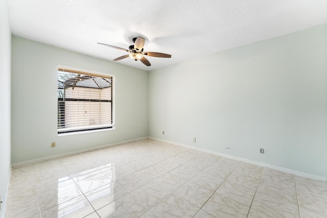 2561 Carambola Cir N Unit 1848Bldg 8, Coconut Creek, FL 33066 - empty room with a ceiling fan, baseboards, and a textured ceiling