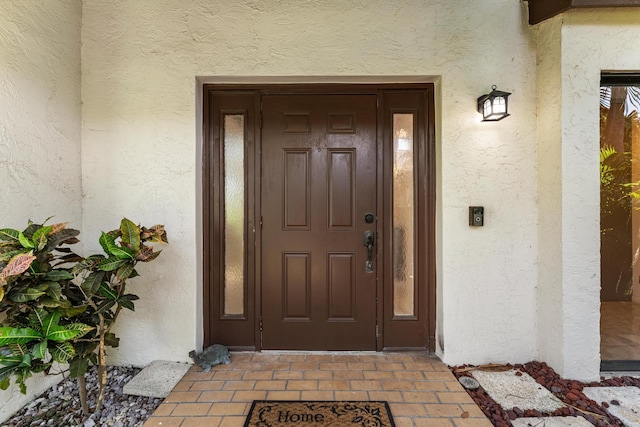 2561 Carambola Cir N Unit 1848Bldg 8, Coconut Creek, FL 33066 - view of exterior entry with stucco siding