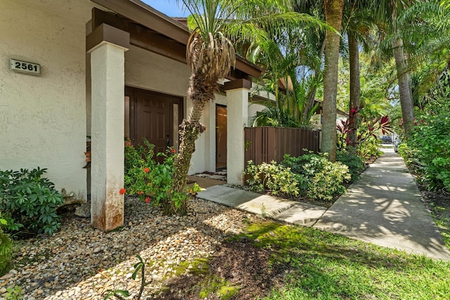 2561 Carambola Cir N Unit 1848Bldg 8, Coconut Creek, FL 33066 - view of exterior entry featuring stucco siding