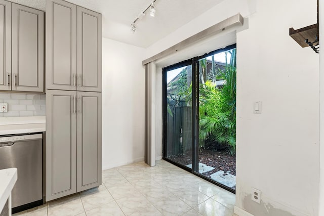 2561 Carambola Cir N Unit 1848Bldg 8, Coconut Creek, FL 33066 - doorway with rail lighting and baseboards