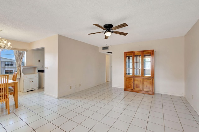 332 Sheffield N, West Palm Beach, FL 33417 - empty room featuring a chandelier, a ceiling fan, and a textured ceiling