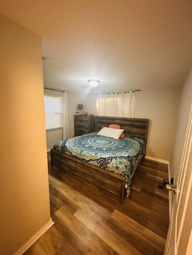 2002 N 50th St, Fort Pierce, FL 34947 - bedroom featuring wood finished floors and baseboards