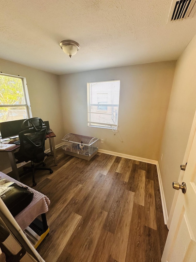 2002 N 50th St, Fort Pierce, FL 34947 - office with wood finished floors, baseboards, and a textured ceiling
