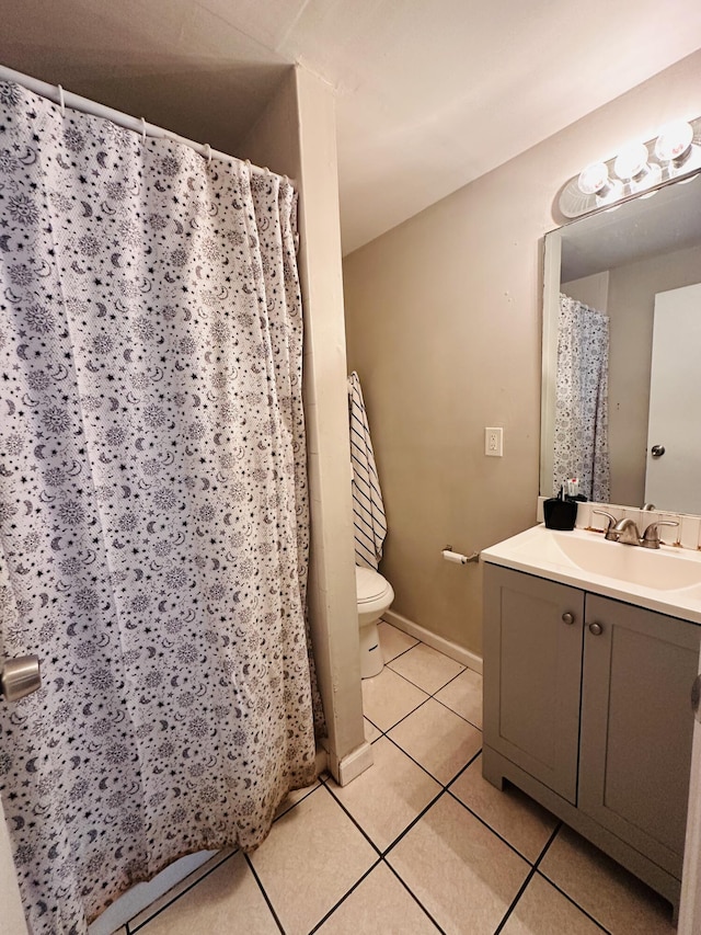 2002 N 50th St, Fort Pierce, FL 34947 - bathroom featuring tile patterned floors, toilet, vanity, curtained shower, and baseboards