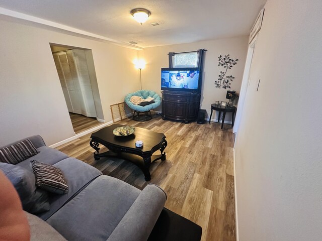 2002 N 50th St, Fort Pierce, FL 34947 - living area featuring light wood-style flooring and baseboards