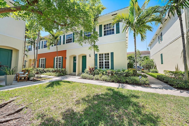 259 SW 7th Ct, Pompano Beach, FL 33060 - view of property with a front yard and stucco siding