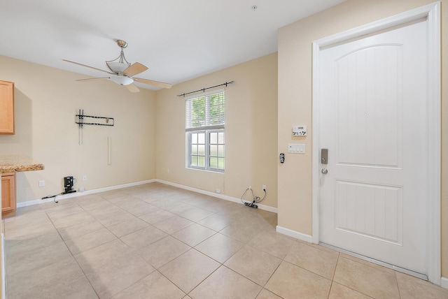 259 SW 7th Ct, Pompano Beach, FL 33060 - foyer entrance featuring a ceiling fan, light tile patterned floors, and baseboards