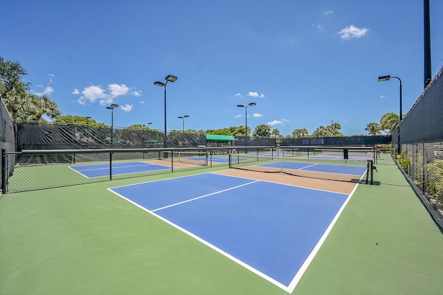 view of tennis court featuring community basketball court
