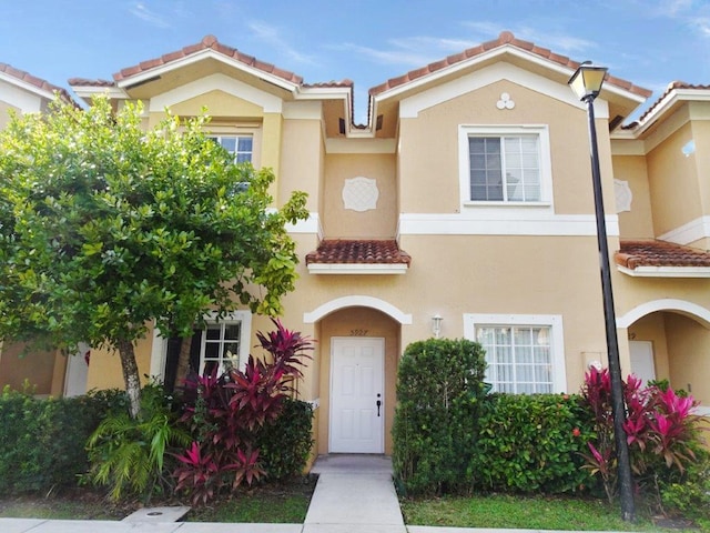 5927 Riverside Ave, Tamarac, FL 33321 - view of front of house featuring a tile roof and stucco siding