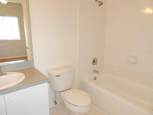 5927 Riverside Ave, Tamarac, FL 33321 - bathroom featuring toilet, vanity, and bathtub / shower combination