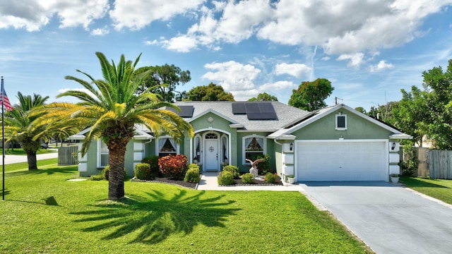 401 SE Ron Rico Ter, Port Saint Lucie, FL 34983 - view of front of property with stucco siding, a garage, driveway, solar panels, and roof with shingles