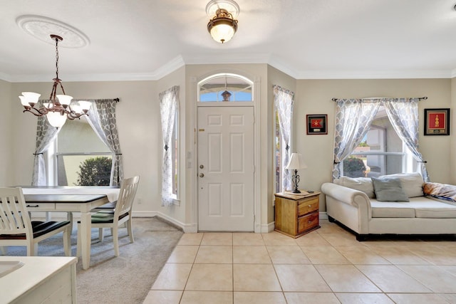 401 SE Ron Rico Ter, Port Saint Lucie, FL 34983 - entryway featuring a chandelier, healthy amount of natural light, crown molding, and light tile patterned floors