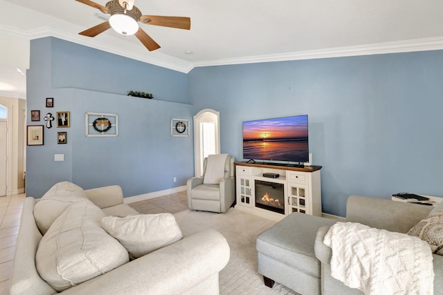 401 SE Ron Rico Ter, Port Saint Lucie, FL 34983 - living room featuring ornamental molding, arched walkways, ceiling fan, baseboards, and light tile patterned flooring