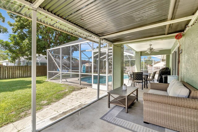 401 SE Ron Rico Ter, Port Saint Lucie, FL 34983 - sunroom featuring a ceiling fan and outdoor dining area