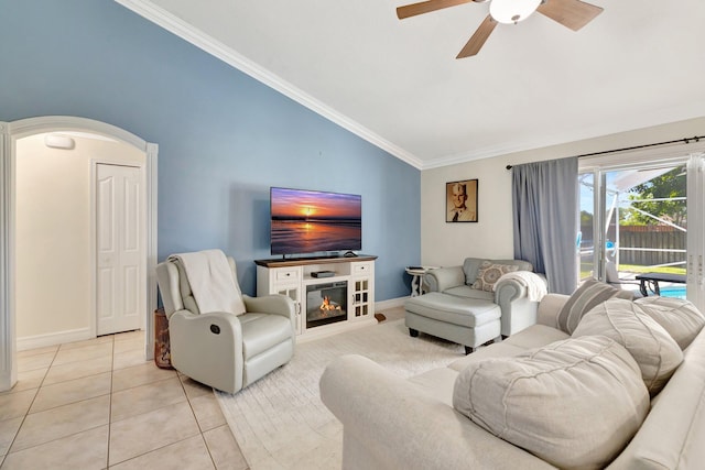 401 SE Ron Rico Ter, Port Saint Lucie, FL 34983 - living area featuring lofted ceiling, ceiling fan, ornamental molding, light tile patterned floors, and arched walkways
