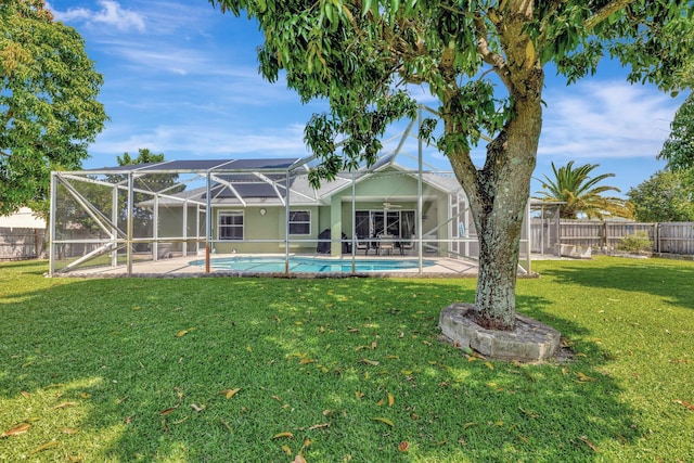 401 SE Ron Rico Ter, Port Saint Lucie, FL 34983 - rear view of property with a patio area and a lanai