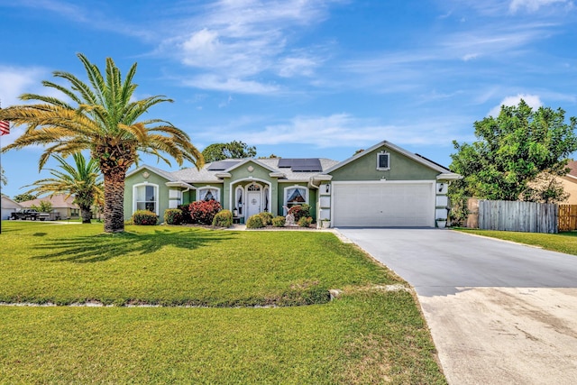 401 SE Ron Rico Ter, Port Saint Lucie, FL 34983 - single story home featuring stucco siding, concrete driveway, roof mounted solar panels, and an attached garage