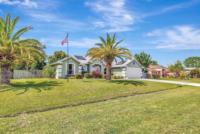 401 SE Ron Rico Ter, Port Saint Lucie, FL 34983 - view of front of property featuring driveway, solar panels, and an attached garage
