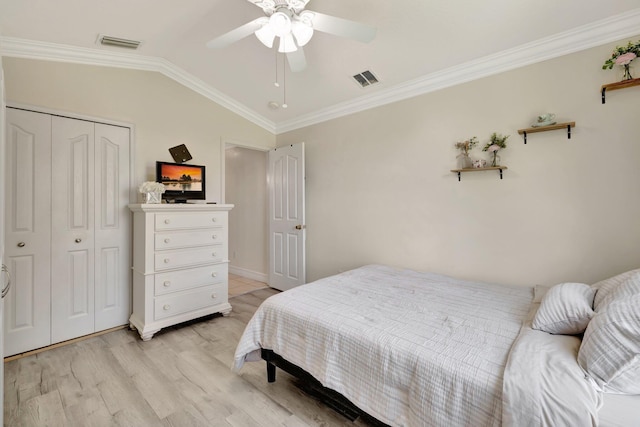 401 SE Ron Rico Ter, Port Saint Lucie, FL 34983 - bedroom featuring light wood-type flooring, vaulted ceiling, a closet, ornamental molding, and a ceiling fan