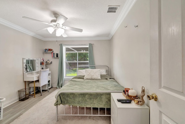 401 SE Ron Rico Ter, Port Saint Lucie, FL 34983 - bedroom featuring wood finished floors, crown molding, ceiling fan, and baseboards
