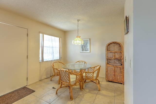 25 Lake Vista Trl Unit 203, Port Saint Lucie, FL 34952 - dining room with light tile patterned floors and a textured ceiling