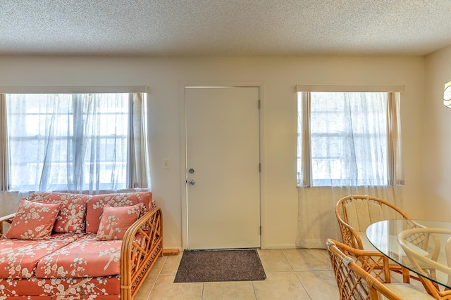 25 Lake Vista Trl Unit 203, Port Saint Lucie, FL 34952 - foyer entrance with light tile patterned flooring and a textured ceiling