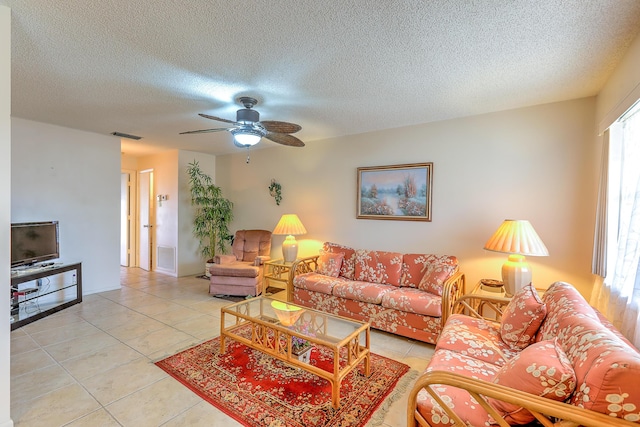 25 Lake Vista Trl Unit 203, Port Saint Lucie, FL 34952 - living room with light tile patterned flooring, ceiling fan, and a textured ceiling