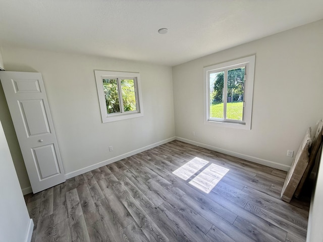 1962 SE Manth Ln, Port Saint Lucie, FL 34983 - spare room with wood finished floors and baseboards