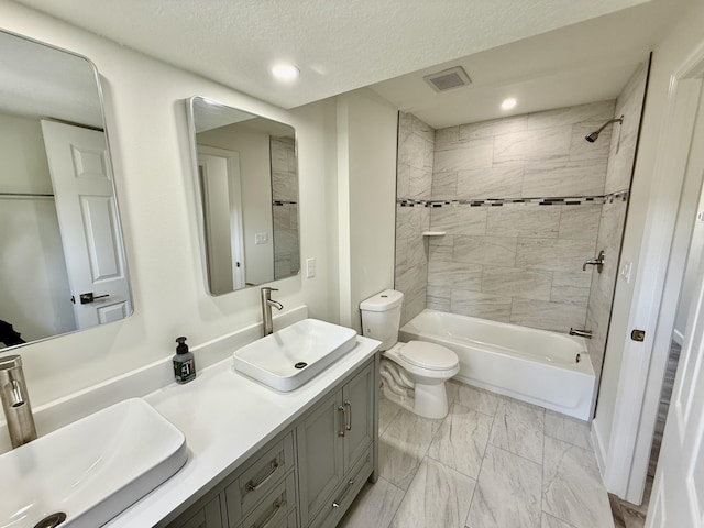 1962 SE Manth Ln, Port Saint Lucie, FL 34983 - bathroom featuring toilet, washtub / shower combination, marble finish flooring, recessed lighting, and double vanity