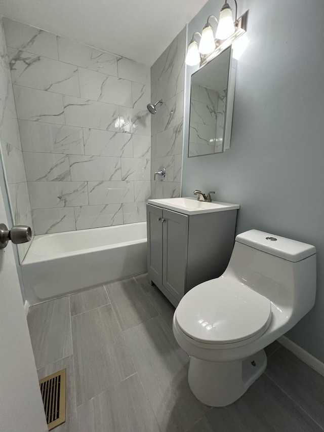 702 48th St, West Palm Beach, FL 33407 - full bathroom featuring toilet, vanity, tub / shower combination, and wood finish floors