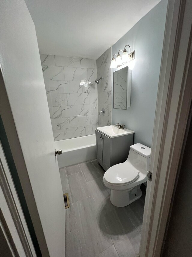 702 48th St, West Palm Beach, FL 33407 - full bathroom with toilet, shower / bathtub combination, and vanity
