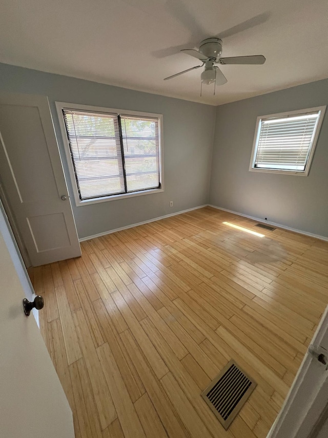 702 48th St, West Palm Beach, FL 33407 - empty room with a ceiling fan, light wood-style flooring, and baseboards