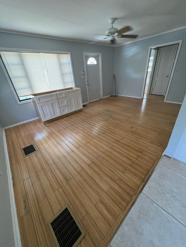 702 48th St, West Palm Beach, FL 33407 - entrance foyer featuring ceiling fan, light wood-type flooring, and baseboards