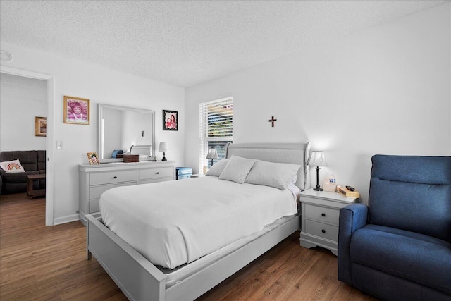 884 Worcester Ln, Lake Worth, FL 33467 - bedroom featuring dark wood-type flooring and a textured ceiling