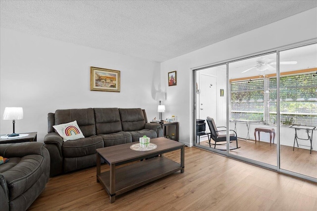 884 Worcester Ln, Lake Worth, FL 33467 - living room with wood finished floors, a textured ceiling, and a ceiling fan