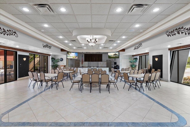 884 Worcester Ln, Lake Worth, FL 33467 - tiled dining space featuring a chandelier, a tray ceiling, and recessed lighting