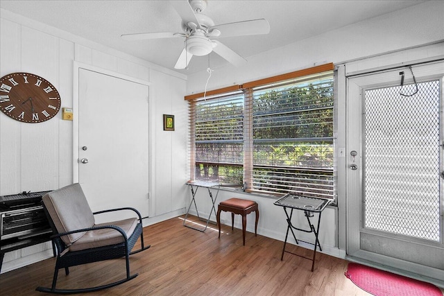 884 Worcester Ln, Lake Worth, FL 33467 - sitting room with wood finished floors, a ceiling fan, and baseboards