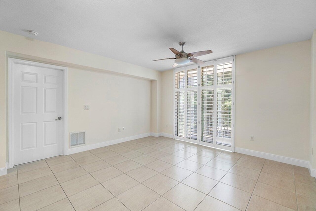 610 Clematis St Unit 236, West Palm Beach, FL 33401 - empty room with ceiling fan, light tile patterned floors, baseboards, and a textured ceiling