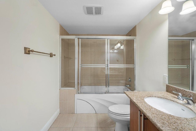 610 Clematis St Unit 236, West Palm Beach, FL 33401 - full bathroom with tile patterned floors, enclosed tub / shower combo, vanity, toilet, and baseboards