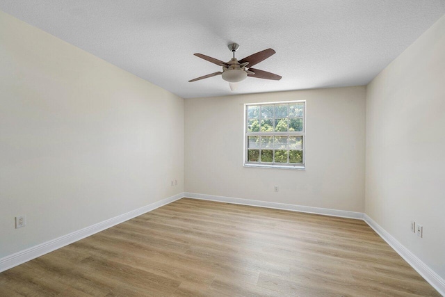 610 Clematis St Unit 236, West Palm Beach, FL 33401 - unfurnished room with light wood finished floors, ceiling fan, baseboards, and a textured ceiling