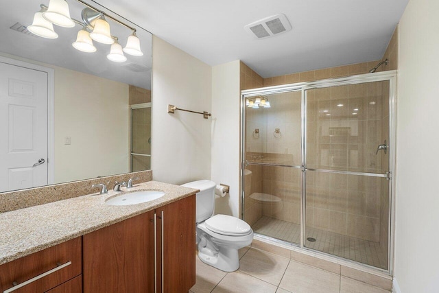 610 Clematis St Unit 236, West Palm Beach, FL 33401 - bathroom featuring a stall shower, tile patterned floors, vanity, and toilet